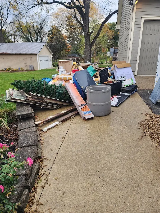 Dumpster being loaded with debris for Commercial Dumpster Rental in Tunkhannock
